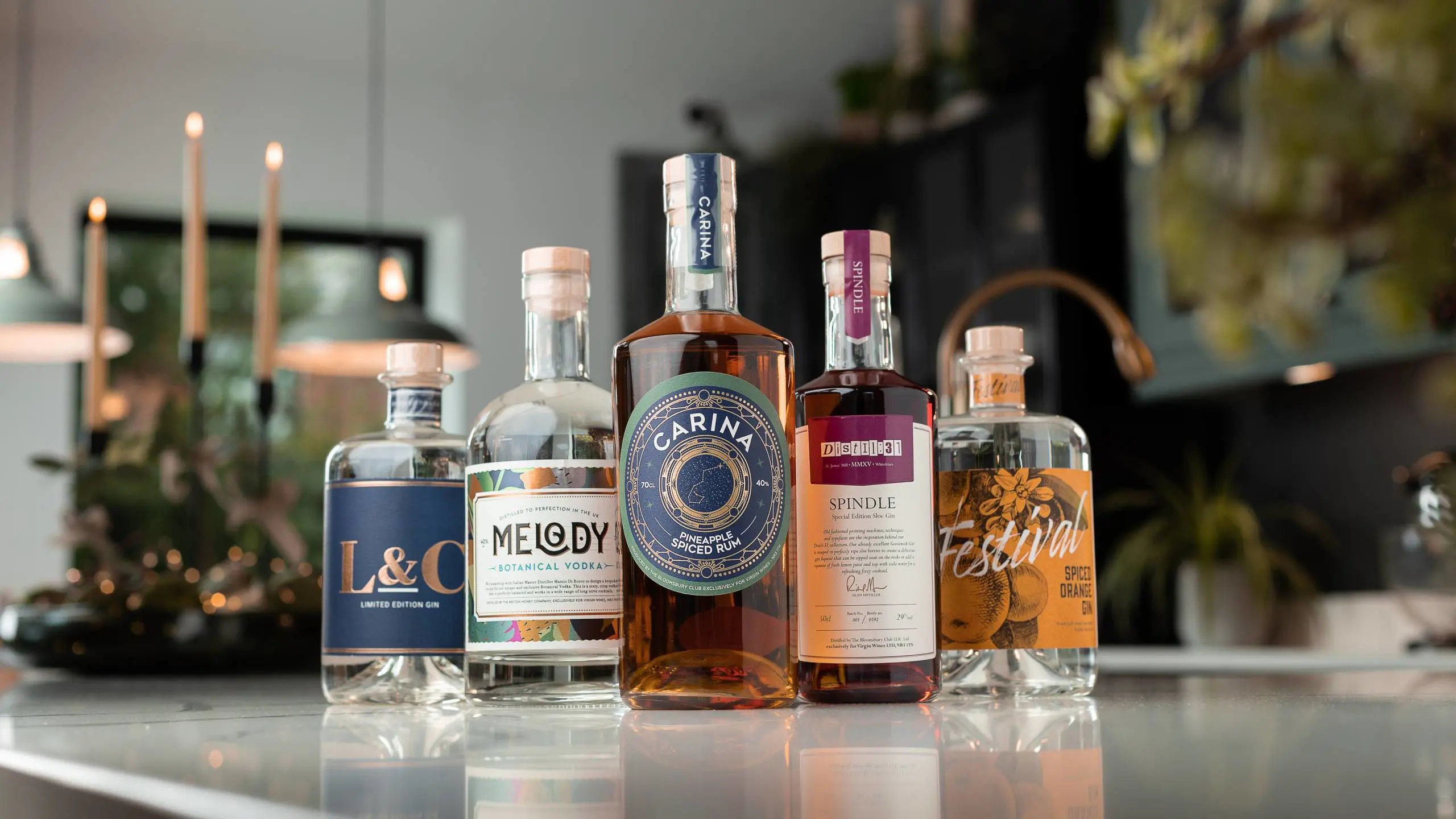 KISS Verkäufe -KISS Verkäufe Line up of exclusive gins vodkas and rums by Virgin Wines on a festive kitchen worktop 2560x1440 1